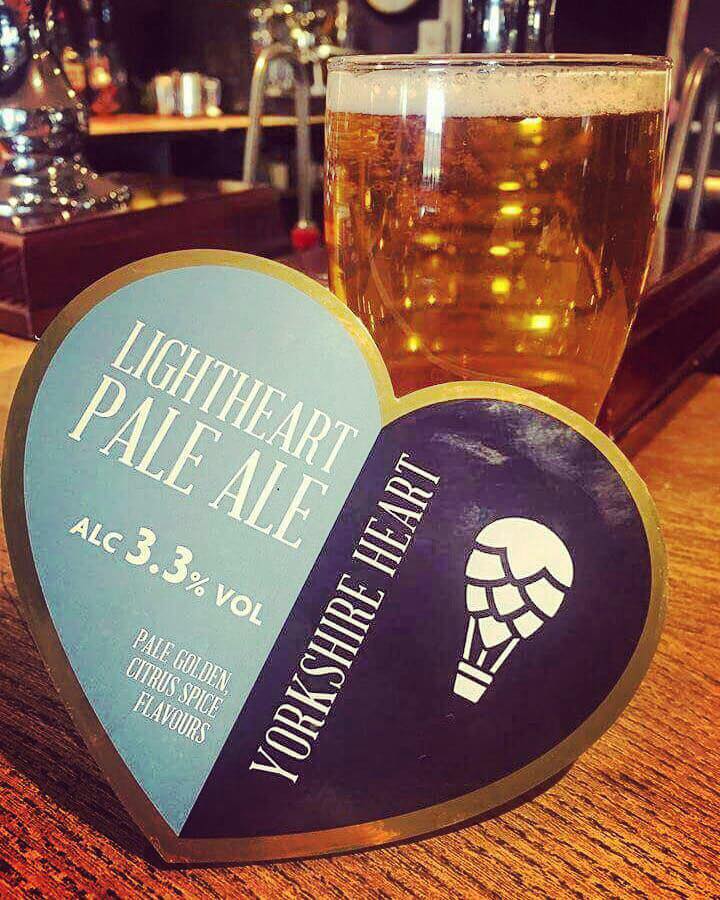Lightheart Pale Ale pint glass and heart coaster