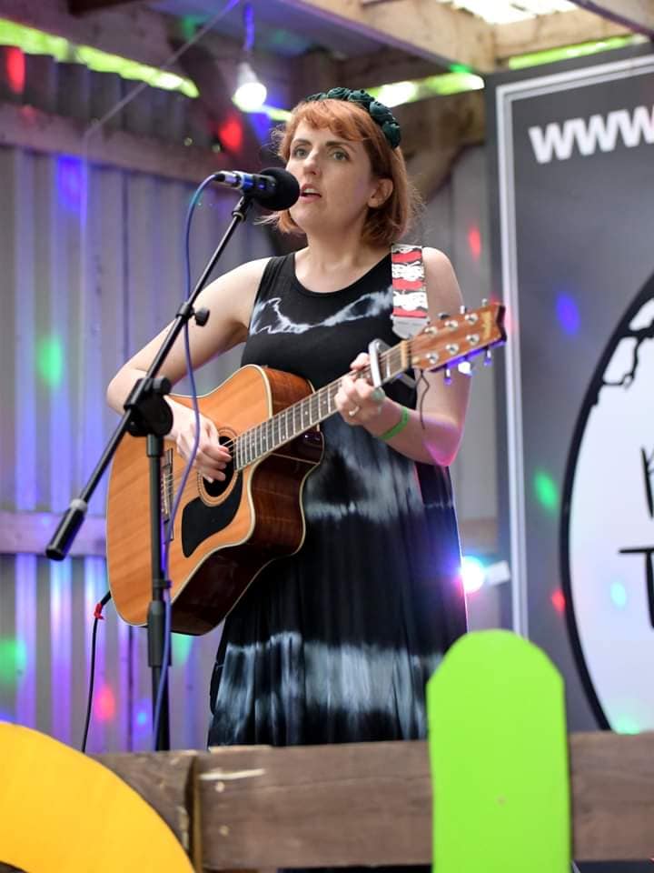 Lu Brown playing guitar